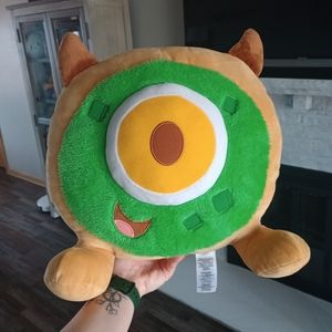 Green and Tan Plush Toy